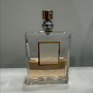 CHANEL Clear Glass Perfume Bottle with Gold Accents